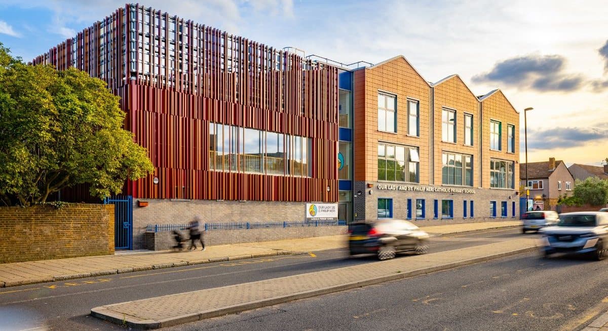 The school after re-cladding, with terracotta fins and brick tile